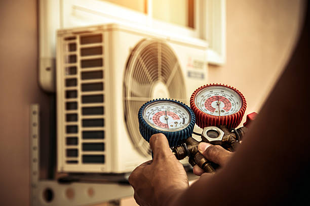 Professional Air Conditioning Service technician working in Elmhurst, NY